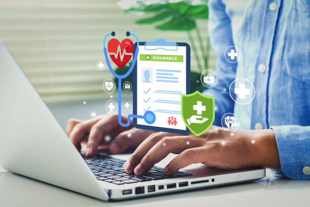 Close-up of a male hands put on a laptop with a health insurance diagram popping out of the screen